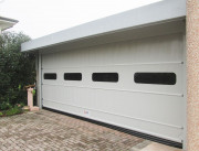 Portes sectionnelles à enroulement rapide