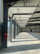 Installation porte sectionnelle industrielle sur mesure - Isolante - Avec système anti-effraction