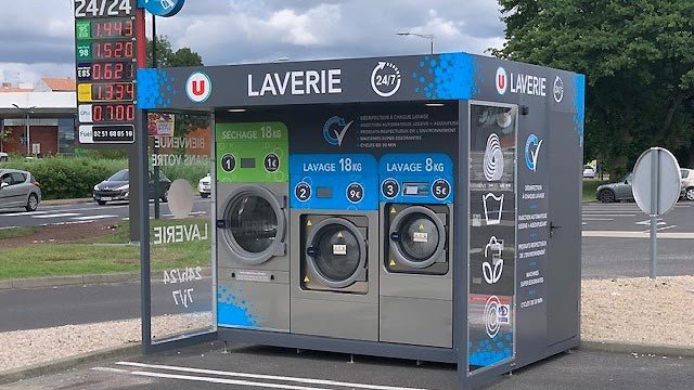 Distributeur automatique de lessive pour laverie automatique